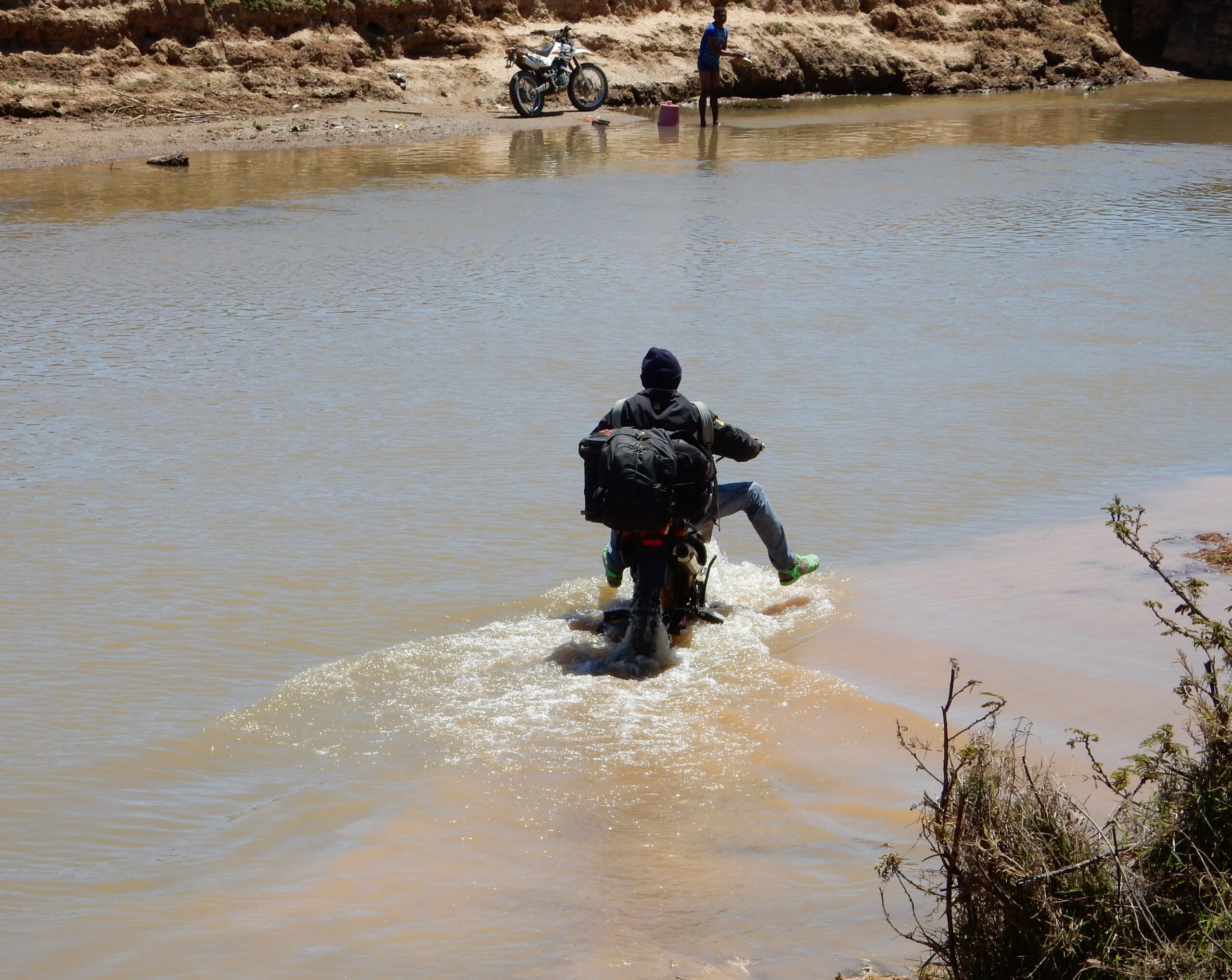 Riders navigating a remote river crossing in Madagascar